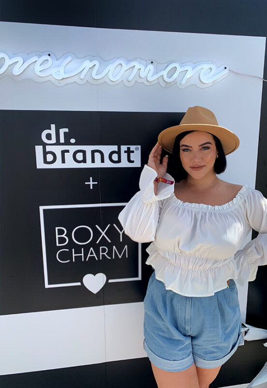 Woman in front of DrBrandt Boxy Charm at Coachella