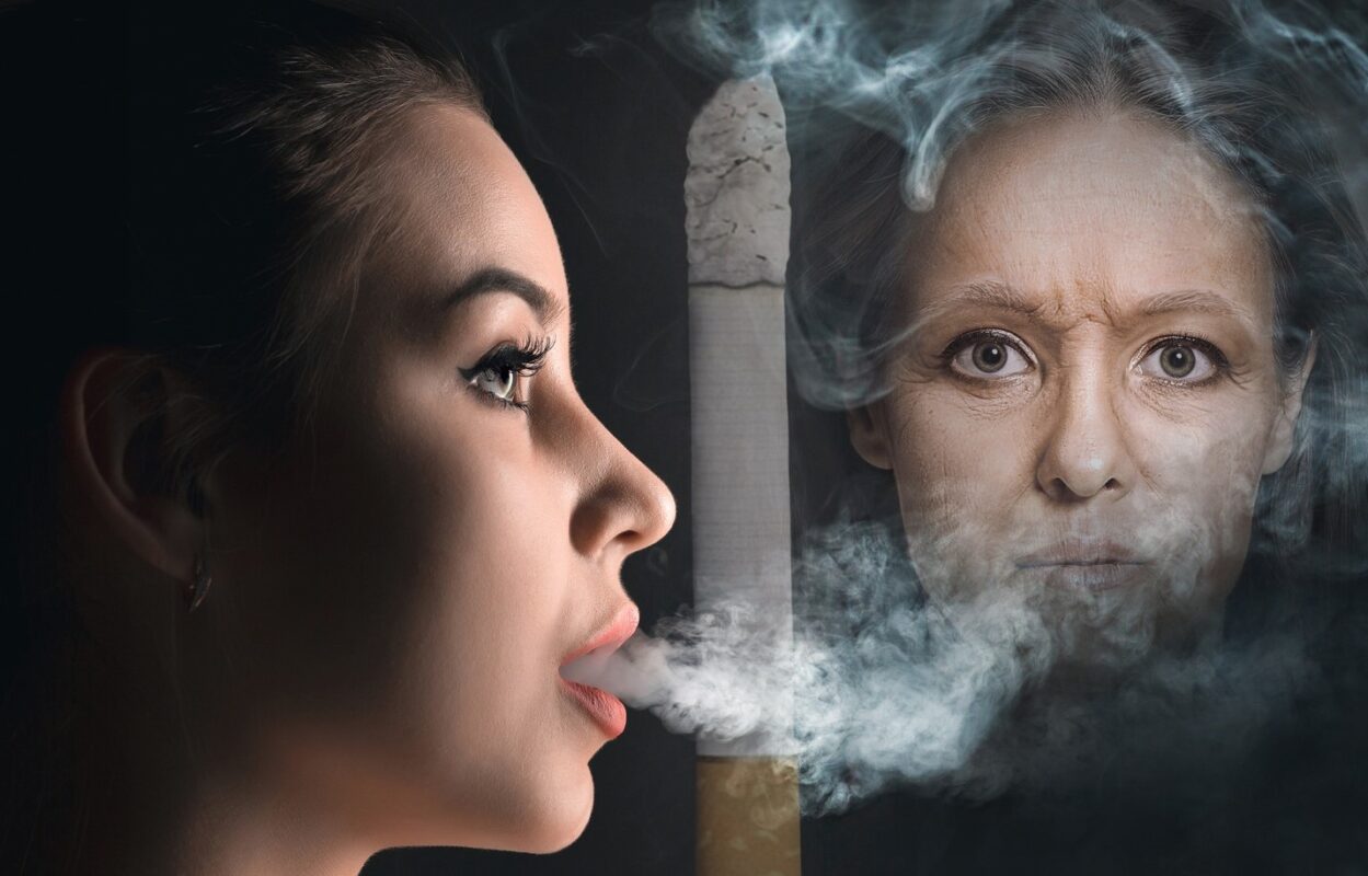 Woman smoking facing an old woman integrated dermatology
