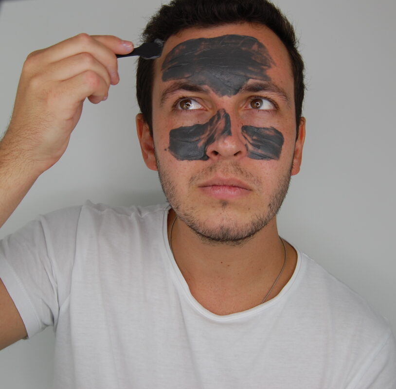 Men applying a face mask
